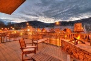fire pit with mountain view on the balcony of Black Bear Inn & Suites