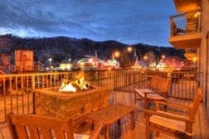 Balcony with chairs and fire pit overlooking Gatlinburg