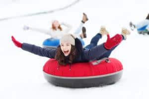 smiling girl snow tubing at ober gatlinburg