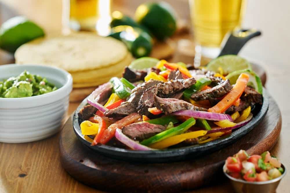 beef fajitas with guacamole and tortillas