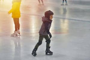 boy ice skating inside